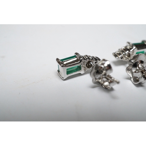 916 - A small modern pair of 14k white metal, emerald and diamond cluster set ear studs, 9mm, gross weight... 