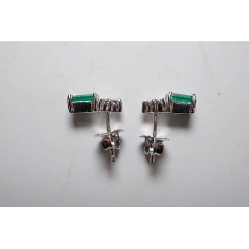 916 - A small modern pair of 14k white metal, emerald and diamond cluster set ear studs, 9mm, gross weight... 