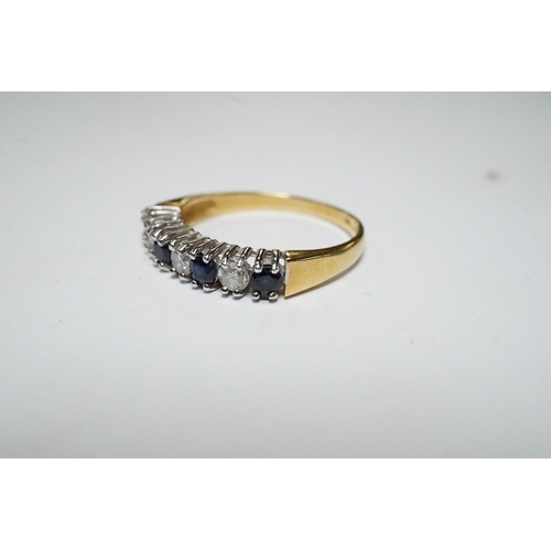 919 - A modern 18ct gold, four stone sapphire and three stone diamond set half hoop ring, size L/M, gross ... 