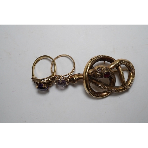 921 - A Victorian yellow metal and gem set coiled serpent brooch, 47mm, together with two 1960's 9ct gold ... 