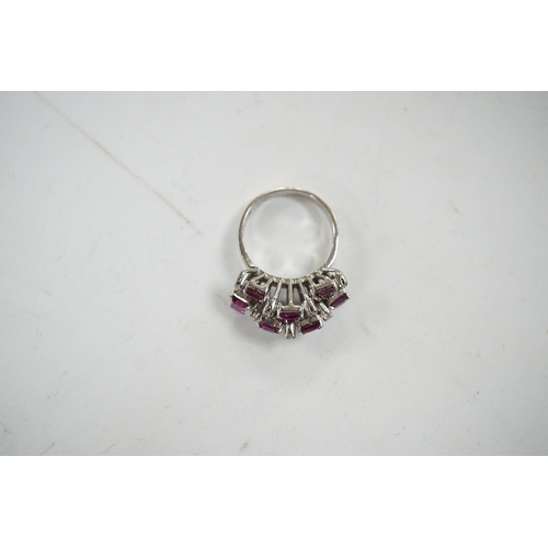 925 - An 18k white metal, ruby and diamond cluster set cocktail ring, size K/L, gross weight 5.7 grams. Co... 