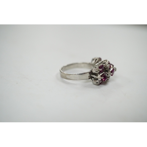 925 - An 18k white metal, ruby and diamond cluster set cocktail ring, size K/L, gross weight 5.7 grams. Co... 