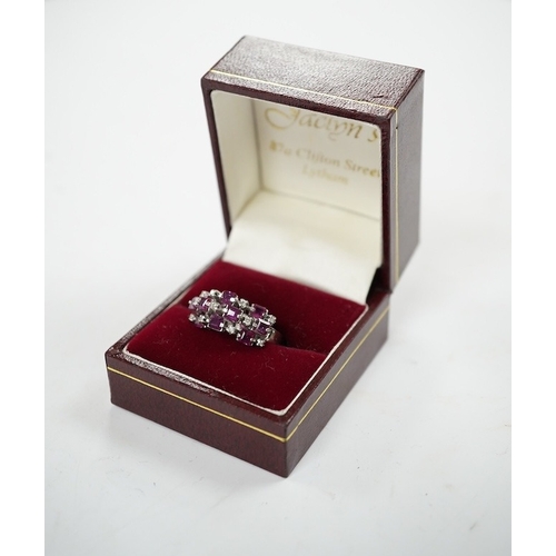 925 - An 18k white metal, ruby and diamond cluster set cocktail ring, size K/L, gross weight 5.7 grams. Co... 