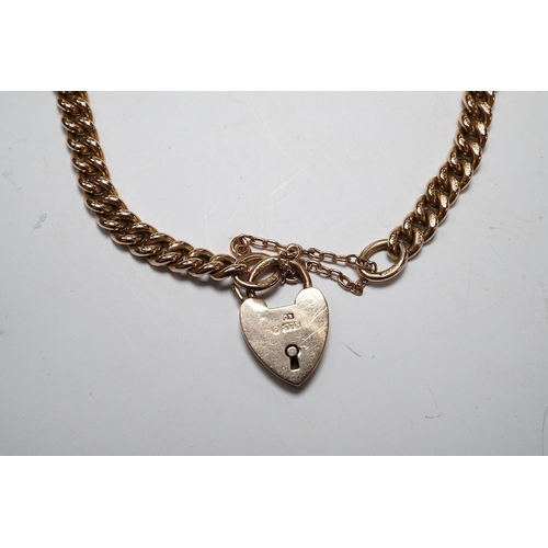 926 - A 9ct god curb link bracelet, with heart shaped padlock clasp, 18cm, 13.8 grams. Condition - fair to... 