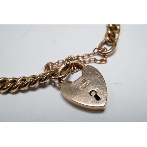 926 - A 9ct god curb link bracelet, with heart shaped padlock clasp, 18cm, 13.8 grams. Condition - fair to... 