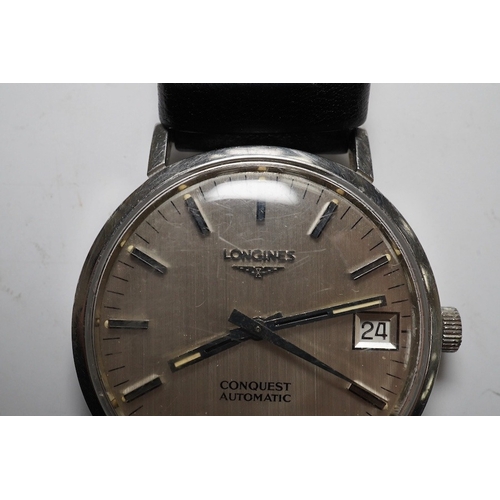 930 - A gentleman's stainless steel Longines Conquest Automatic wrist watch, on an associated leather stra... 