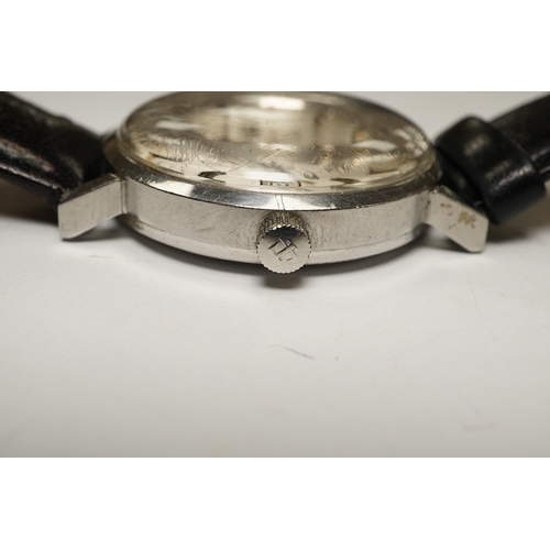 930 - A gentleman's stainless steel Longines Conquest Automatic wrist watch, on an associated leather stra... 