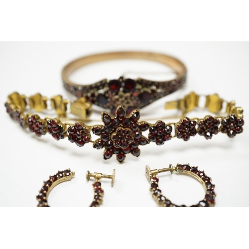 931 - Three items of gilt white metal and garnet paste cluster set jewellery, comprising a bracelet, bangl... 