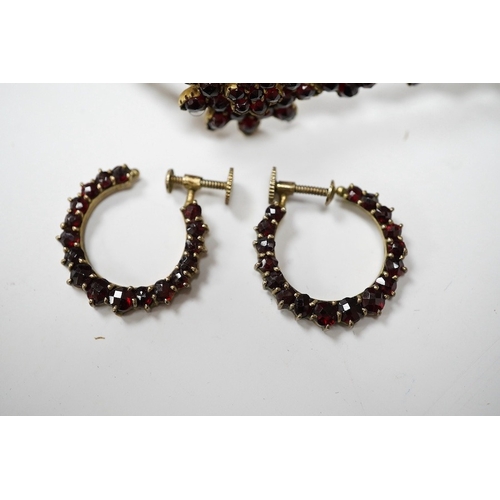 931 - Three items of gilt white metal and garnet paste cluster set jewellery, comprising a bracelet, bangl... 