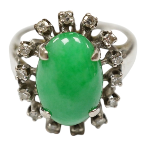 934 - A white metal, jade and diamond set oval cluster ring, size N, gross weight 5.4 grams. Condition - f... 