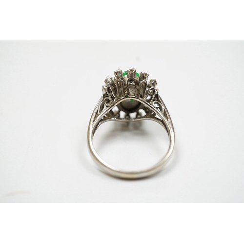 934 - A white metal, jade and diamond set oval cluster ring, size N, gross weight 5.4 grams. Condition - f... 