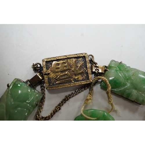 935 - A Chinese gilt white metal and carved jade panel set bracelet, a.f, 17.5cm, together with a carved j... 