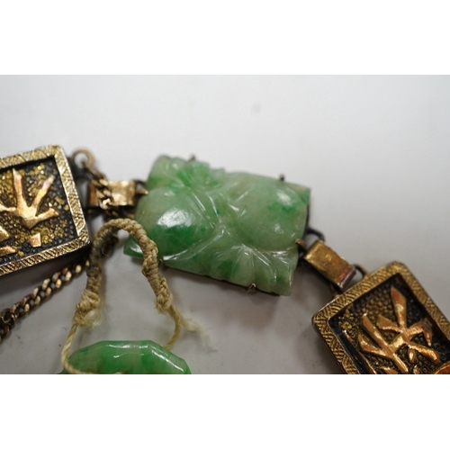 935 - A Chinese gilt white metal and carved jade panel set bracelet, a.f, 17.5cm, together with a carved j... 