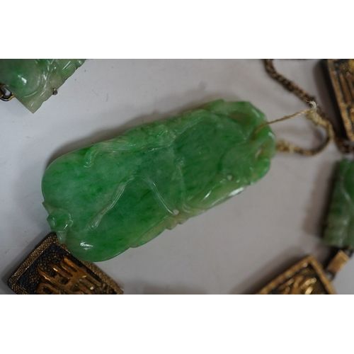 935 - A Chinese gilt white metal and carved jade panel set bracelet, a.f, 17.5cm, together with a carved j... 