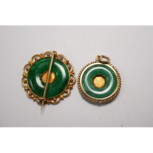 938 - A Chinese 18k and jade set circular brooch, 23mm and a similar yellow metal and jade set pendant, gr... 