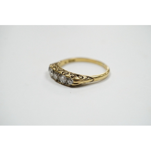 939 - A yellow metal and graduated five stone diamond set half hoop ring, size O, gross weight 3.1 grams. ... 