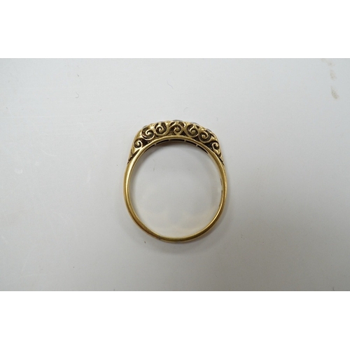 939 - A yellow metal and graduated five stone diamond set half hoop ring, size O, gross weight 3.1 grams. ... 