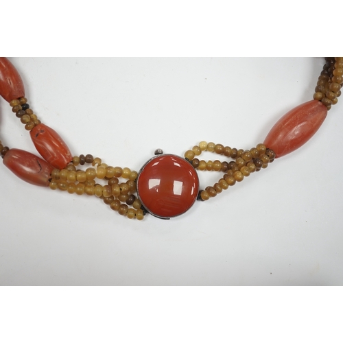 946 - A mid 20th century Chinese chalcedony necklace, with carved pendant and sterling clasp, overall 54cm... 