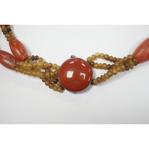 946 - A mid 20th century Chinese chalcedony necklace, with carved pendant and sterling clasp, overall 54cm... 