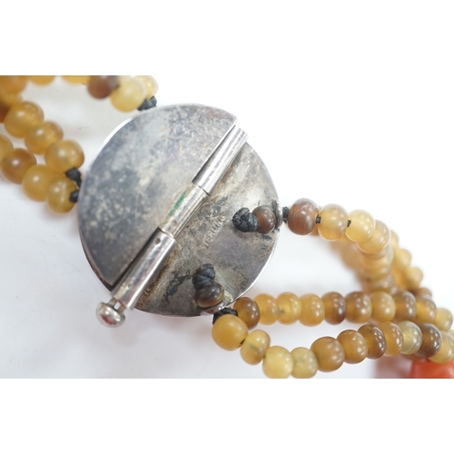 946 - A mid 20th century Chinese chalcedony necklace, with carved pendant and sterling clasp, overall 54cm... 