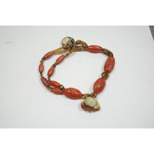 946 - A mid 20th century Chinese chalcedony necklace, with carved pendant and sterling clasp, overall 54cm... 