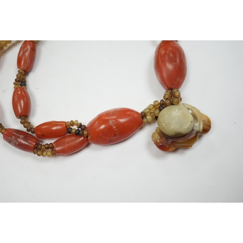 946 - A mid 20th century Chinese chalcedony necklace, with carved pendant and sterling clasp, overall 54cm... 