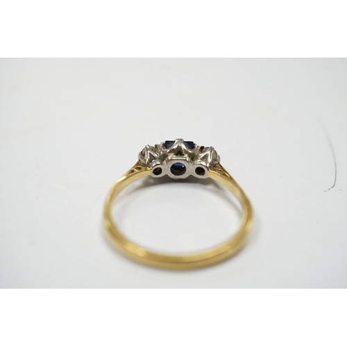 947 - A yellow metal, sapphire and diamond set three stone ring, size Q, gross weight 3 grams. Condition -... 