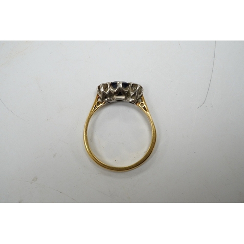 947 - A yellow metal, sapphire and diamond set three stone ring, size Q, gross weight 3 grams. Condition -... 