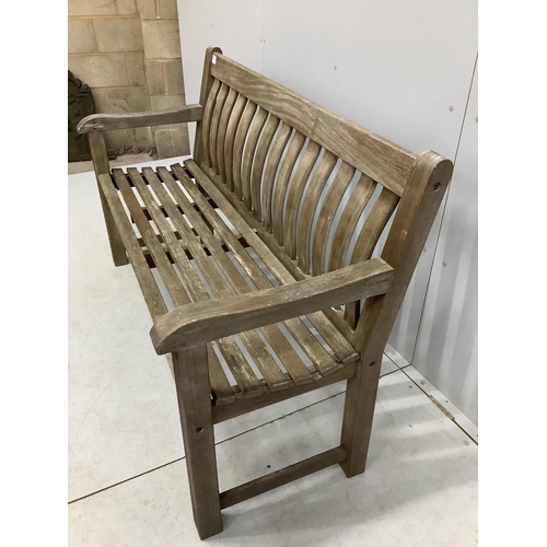 1013 - A weathered teak slatted garden bench, width 146cm, depth 52cm, height 92cm. Condition - good but we... 