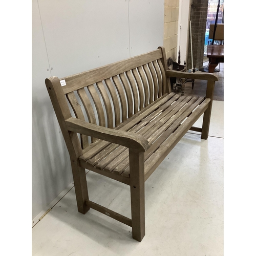 1013 - A weathered teak slatted garden bench, width 146cm, depth 52cm, height 92cm. Condition - good but we... 