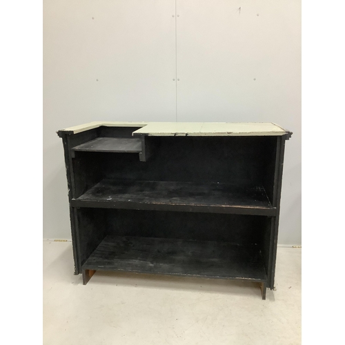 1016 - A painted panelled pine shop counter with till recess and chrome hanging rail. width 133cm, depth 60... 