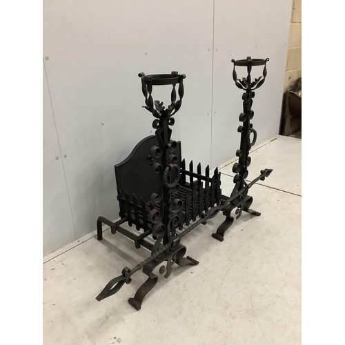 1026 - A French wrought iron fire basket with dogs and cast fire back, width 127cm, depth 53cm, height 88cm... 