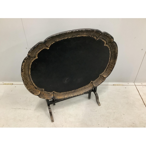 1035 - A Victorian oval papier mache folding occasional table, width 79cm, depth 64cm, height 54cm. Conditi... 