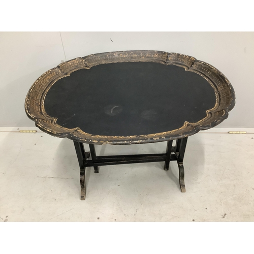 1035 - A Victorian oval papier mache folding occasional table, width 79cm, depth 64cm, height 54cm. Conditi... 