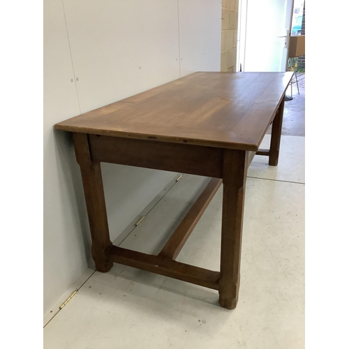 1043 - A rectangular French cherry kitchen table, width 179cm, depth 79cm, height 76cm. Condition - fair to... 