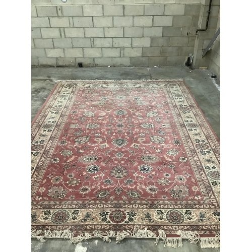 1064 - A Kashan style peach ground machined carpet, 360 x 274cm. Condition - fair to good, will require cle... 