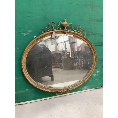 1067 - Two late Victorian / Edwardian Sheraton Revival oval giltwood and composition wall mirrors, larger w... 