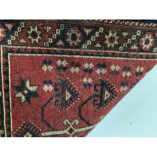 1089 - A Kazak style red ground rug, (moth damage) and a Turkish red ground rug, larger 200 x 98cm. Conditi... 