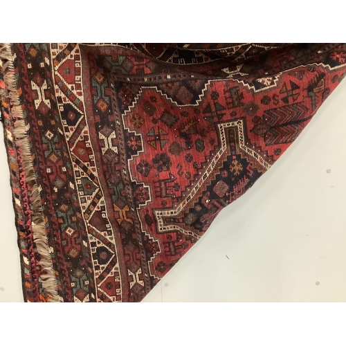 1090 - A Qashqai brick red ground rug, 216 x 160cm. Condition - fair to good