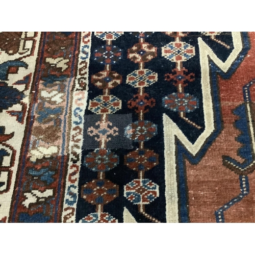 1091 - A Mazleghan blue ground rug, 194 x 136cm. Condition - fair but has a patch repair