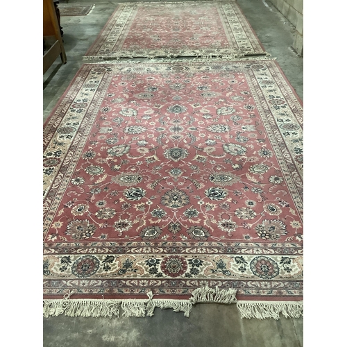 1104 - A Kashan style peach ground machined carpet, 360 x 274cm. Condition - fair to good, will require cle... 