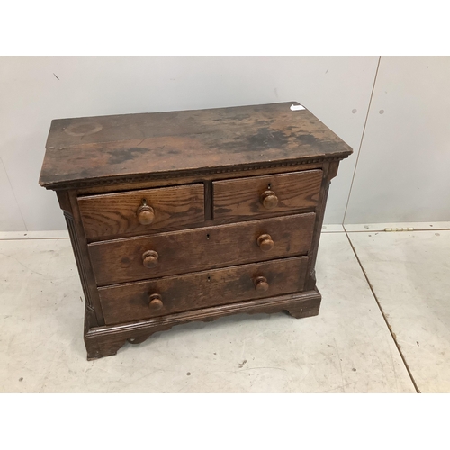 1107 - An 18th century miniature oak chest of two short and two long drawers, possibly childs furniture, w... 