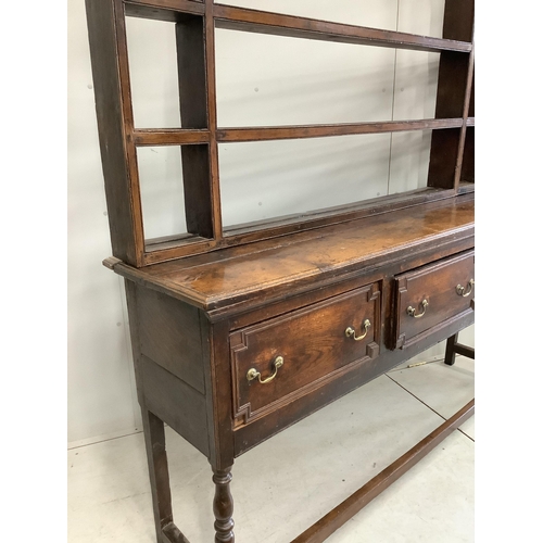 1121 - An 18th century oak dresser with open rack, width 176cm, depth 46cm, height 199cm. Condition - fair... 