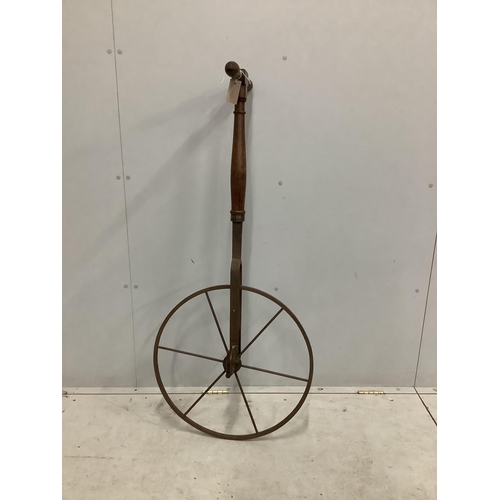 1122 - A 19th century Waywiser with six spoke iron wheel and brass dial, height 128cm. Condition - poor to ... 