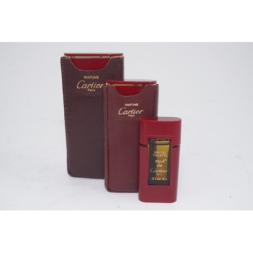 1252 - An assortment of Must de Cartier bordeaux leather accessories including small coin purse, two wallet... 