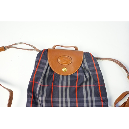 1256A - Two tartan canvas with leather trim Burberry bags, one backpack and one bucket bag