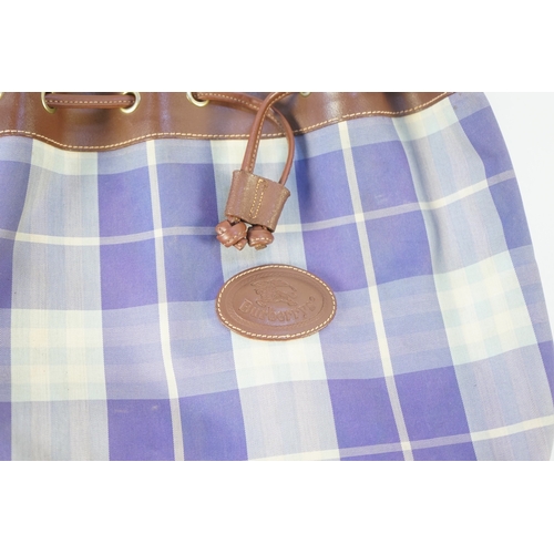 1256A - Two tartan canvas with leather trim Burberry bags, one backpack and one bucket bag