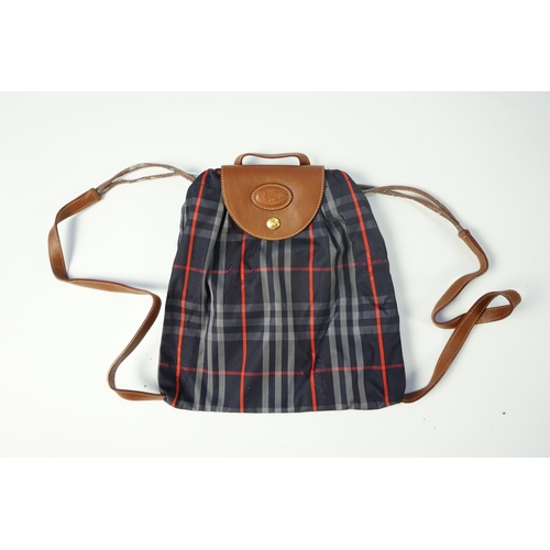 1256A - Two tartan canvas with leather trim Burberry bags, one backpack and one bucket bag