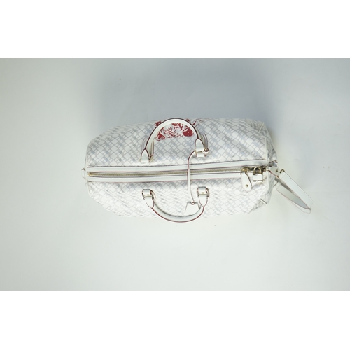 1258 - A large white monogram Bally weekend bag 'Berlinda' with red tiger detail, red lining, additional ke... 