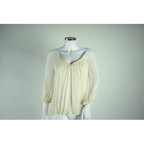 1263 - A Diane von Furstenberg cream silk lady's blouse with rope detail, a Dusk for Frank Usher cream silk... 